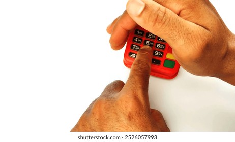 Covering keyboard with hand while type the password on bank POS payment terminal on the white background with copy space.

