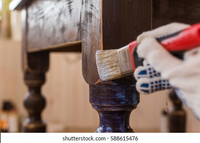 Covering varnish of old wooden table. 