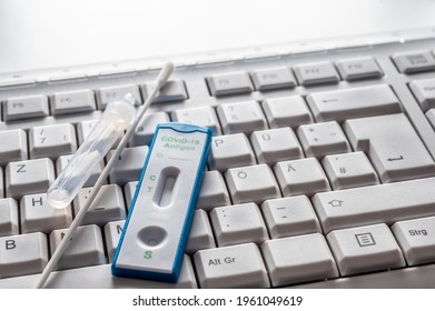 Covid 19 Antigen Test On A Computer Keyboard Symbolizing Tests In The Workplace