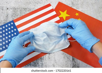 Covid - 19, Coronavirus Concept. China Helps USA Fight Coronavirus, USA And China Flags And Medical Mask, Coronavirus Epidemic In United States Of America Concept