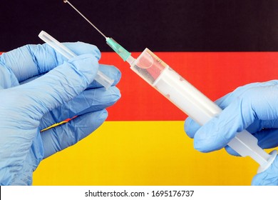 Covid - 19, Coronavirus Concept. Syringe On Germany Flag, Coronavirus Epidemic In Germany