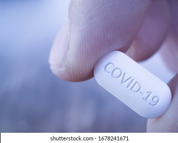 COVID 19 Coronavirus Cure drug concept in one tablet. Concept for antiviral drug for new korona virus. Medication pharmaceutical for Corona treatment. Close up concept for Covid Cure 