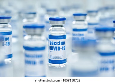 Covid 19 Coronavirus Vaccine Vial Bottle For Intramuscular Injections On Medical Pharmaceutical Industry Background. Corona Virus Cure Manufacture, Flu Treatment Drug Pharmacy Production Concept.