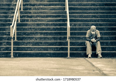 Covid 19 Nurse Sitting On The Hospital Steps De Stressing From Work.