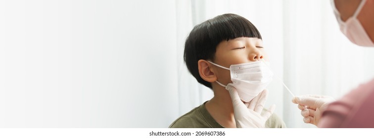 Covid 19 Testing Before Back To School. An Asian Mom Gently Do A Nose Swab Rapid Test For Her Little Boy At Home. Living With Covid, Delta, Mu, New Normal, Student, Kids, Small, How To, Tested, Reopen