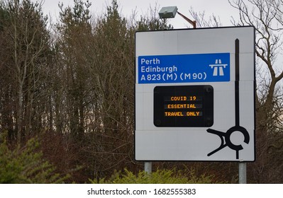 Covid 19 Travel Only If Essential Warning On Traffic Sign, Edinburgh And Perth Directions, Scotland.