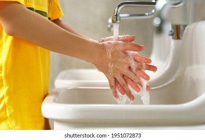 Covid 19, Washing Hands Protect Yourself And Others Concept. An Asian Student Boy Washing His Hands At Wash Basin After School Outdoor Activity. Global Hand Washing Day, Stop Spreading, Awareness.