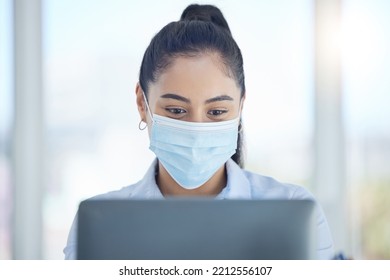 Covid, Business And Woman Reading On Laptop While Working In An Office At Work. Corporate Employee With Email On Computer, Typing Proposal And Doing Search On The Internet With Face Mask At A Company