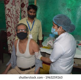 
Covid Or Corona Vaccination Drive In India - Indian Medical Staff Prepares To Vaccinate A Senior Citizen With Covid-19 Vaccine At A Vaccination Center .

Delhi - India 
April 16, 2021 