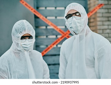 Covid, Coronavirus And Outbreak Healthcare Workers Inspecting Contamination On Site With Red Tape, Protective Masks And Suits. Portrait Of Medical Team Working Together To Fight A Contagious Disease