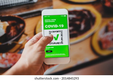 Covid Digital Certificate. Digital Health Passport Application On The Mobile Phone To Enter Restaurants And Services