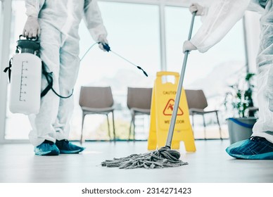 Covid disinfection, cleaning hospital floor with mop and healthcare compliance for safety and hygiene. Disinfecting liquid, cleaner people in PPE for protection from corona virus with medical policy - Powered by Shutterstock