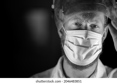 Covid Doctor And Health Care Worker, Putting On A Mask And Face Shield, While Wearing A Lab Coat And Gloves In Australia.