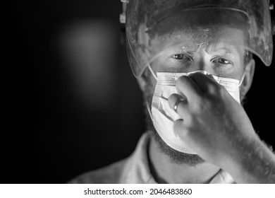 Covid Doctor And Health Care Worker, Putting On A Mask And Face Shield, While Wearing A Lab Coat And Gloves In Australia.