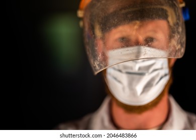 Covid Doctor And Health Care Worker, Putting On A Mask And Face Shield, While Wearing A Lab Coat And Gloves In Australia.