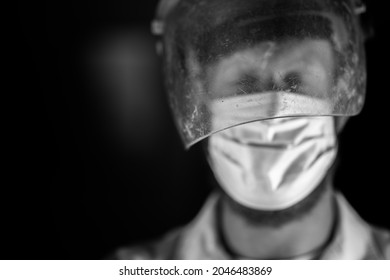 Covid Doctor And Health Care Worker, Putting On A Mask And Face Shield, While Wearing A Lab Coat And Gloves In Australia.