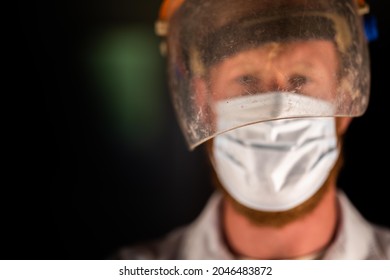 Covid Doctor And Health Care Worker, Putting On A Mask And Face Shield, While Wearing A Lab Coat And Gloves In Australia.