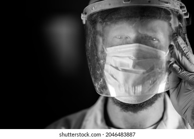 Covid Doctor And Health Care Worker, Putting On A Mask And Face Shield, While Wearing A Lab Coat And Gloves In Australia.