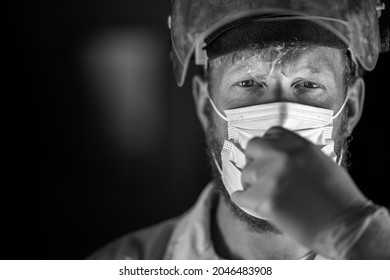 Covid Doctor And Health Care Worker, Putting On A Mask And Face Shield, While Wearing A Lab Coat And Gloves In Australia.