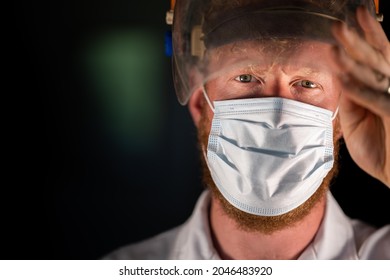 Covid Doctor And Health Care Worker, Putting On A Mask And Face Shield, While Wearing A Lab Coat And Gloves In Australia.