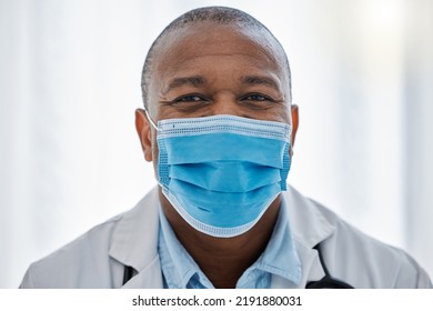 Covid Doctor Wearing Face Mask For Safety, Protection And Hygiene While Working In A Medical Hospital Or Clinic. Portrait Of Trusted Male Physician, Healthcare Expert And Frontline Worker In