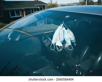 Covid Face Masks Inside Empty Car View Through Windscreen. Auckland, New Zealand - October 16 2019 