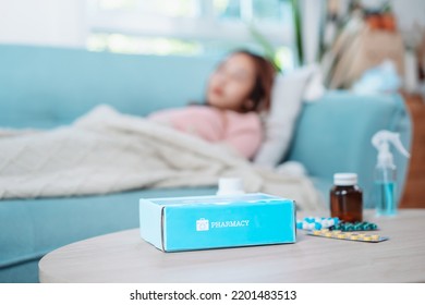 Covid First Aid Box Self Recover Health Care Of Woman Patient Fever, Cold Or Sick Her Sleep On Sofa. Customer Delivery Service From Hospital Online Clinic Retail Rx Drug Store In E-commerce Home Order