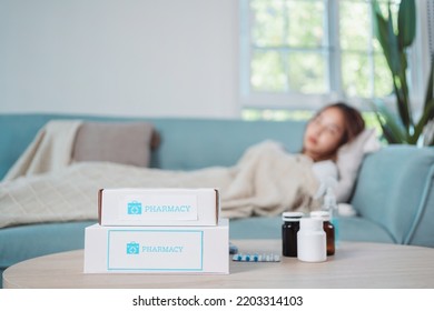 Covid First Aid Box Self Recover Health Care Of Woman Patient Fever, Cold Or Sick Her Sleep On Sofa. Customer Delivery Service From Hospital Online Clinic Retail Rx Drug Store In E-commerce Home Order