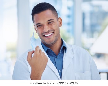 Covid, healthcare and working doctor remove face mask at the end of the pandemic at a hospital. Portrait of a medical surgeon and worker happy with freedom and smile from covid 19 at a clinic - Powered by Shutterstock