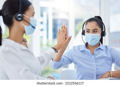 Covid, High Five And Women In Call Center With Face Mask For Office Compliance, Target Success Or Goal Achievement. Sales, Telemarketing Or E Commerce Business People Hands Teamwork, Support And Care