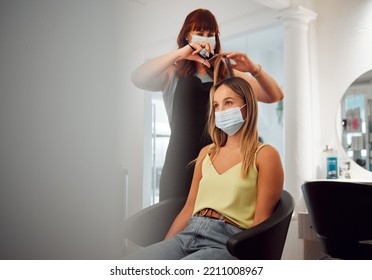 Covid, Mask And Hairdresser Women In Salon With Protection For Professional Hair Grooming Business. Los Angeles Hairstylist Busy Cutting With Medical Face Barrier For Virus Transmission Safety.