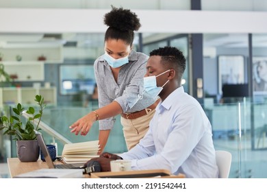 Covid, Masks And Safety In The Workplace Of Business People Working Together During A Pandemic In An Office. Manager, Trainer Or Mentor Training Businessman How To Use Software On Laptop.