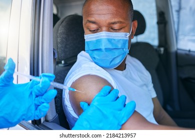 Covid, Medical Worker And Vaccine Site And Service For Patient Getting Flu Shot Or Dose For Coronavirus Prevention. Man In Car Wearing Protective Face Mask To Avoid Contact While Getting An