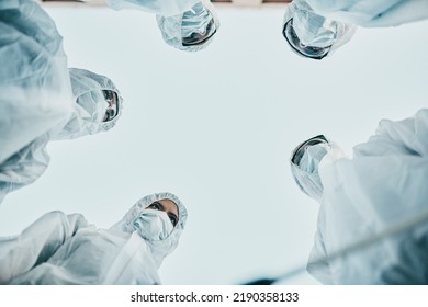 Covid Pandemic Outbreak Team Of Doctors Or Medical Workers Wearing Protective Ppe To Prevent Spread Of Virus In Hospital. Group Of Scientists Wearing Hazmat Suits For Corona Or Ebola Disease In Lab.