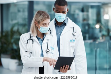 Covid, Planning And Doctors With A Tablet For Healthcare, Medical Partnership And Research On The Internet At A Hospital. Team Of Workers In Medicine Reading Information On Technology With Face Mask