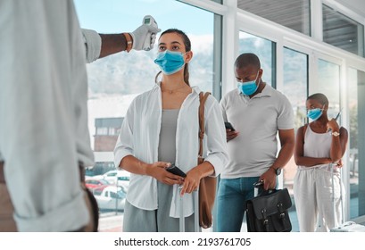 Covid Safety Traveling, Medical Doctor With Thermometer Testing And Screening Or Healthcare Doing Protocol Checkup Of People At Airport. Travel Nurse Worker Scanning During The Corona Virus Pandemic