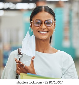 Covid, university and student with smile and face mask at the end of pandemic in classroom at school. Portrait of a happy and young girl removing a mask after covid 19 virus while studying at college - Powered by Shutterstock