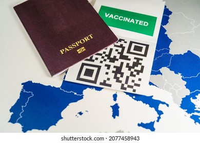 COVID Vaccination With QR Code And A Passport Over An EU Map