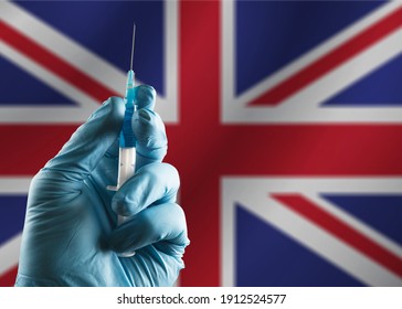 Covid Vaccine Bottle With The UK Flag Background