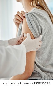 Covid, Vaccine And Doctor Applying Plaster To Patient After Receiving Medical Treatment During Pandemic. Close Up Of Healthcare Worker Putting On Medic Patch After Consulting A Woman At Hospital.