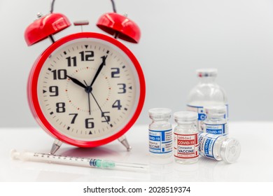 Covid Vaccine Dose Bottle With Time Clock For Coronavirus Vaccination Timing Concept.