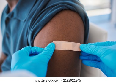 Covid Vaccine, First Aid Or Health And Wellness With Medical Doctor Consulting Patient In Hospital Room. Trust, Safety Or Pharma Nurse Or Healthcare Professional Working With Man For Medicine