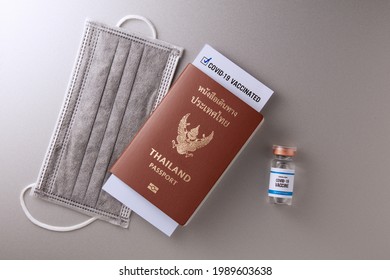 Covid Vaccine Passport And Health Record Card For Travelling. Top View Of Thailand Passport With Immnunity Certification Of Covid-19 Vaccinated By CDC