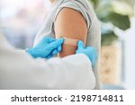 Covid virus vaccination, vaccine and doctor hands with plaster on patient arm in a medical hospital or clinic. Healthcare worker help, trust and safety flu shot antigen for protection against disease