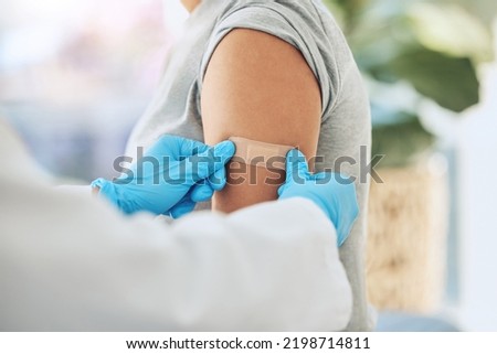 Covid virus vaccination, vaccine and doctor hands with plaster on patient arm in a medical hospital or clinic. Healthcare worker help, trust and safety flu shot antigen for protection against disease