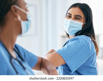 Covid, Women And Doctors Elbow Greeting In Surgical Mask At Hospital Or Clinic During The Pandemic. Teamwork, Healthcare Worker And Medical Professional With Protection From Virus For Doctor Or Nurse