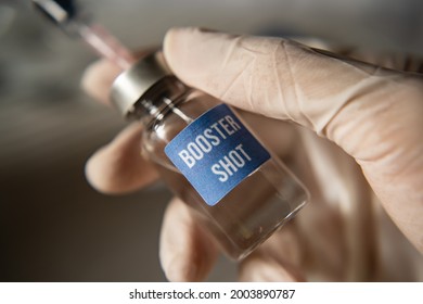 Covid-19 booster shot vaccine concept - Shutterstock ID 2003890787