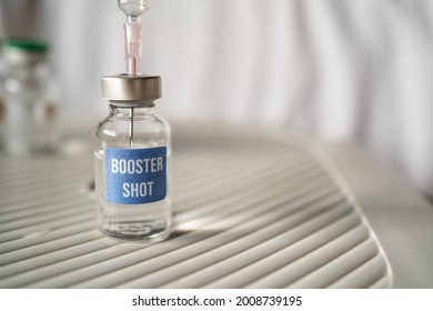 Covid-19 booster shot vaccine concept - Shutterstock ID 2008739195