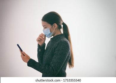 COVID-19 Contact Tracing App On Mobile Phone Woman Walking Outside While Wearing Surgical Medical Mask Touching Her Face Texting Smartphone, Coronavirus Prevention With Geolocation Tracking App.