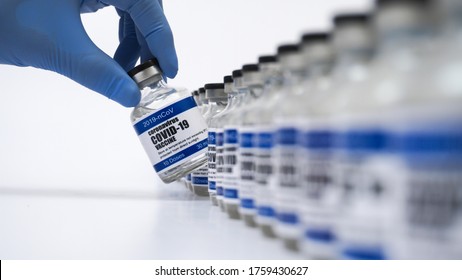 Covid-19 Corona Virus 2019-ncov vaccine vials medicine drug bottles syringe injection blue nitrile surgical gloves. Vaccination, immunization, treatment to cure Covid 19 Corona Virus infection Concept - Powered by Shutterstock